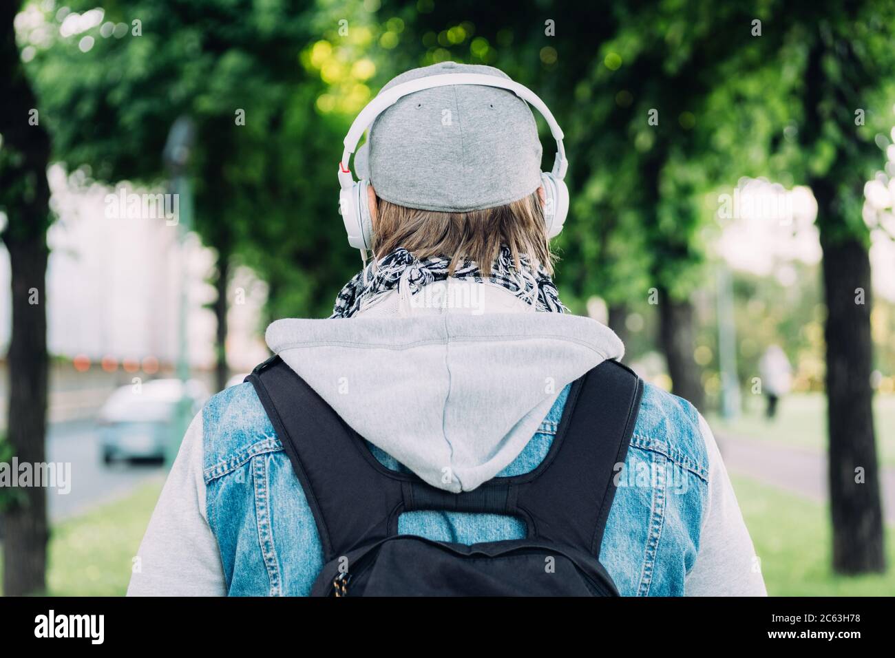 Man in headphones walks hi-res stock photography and images - Alamy