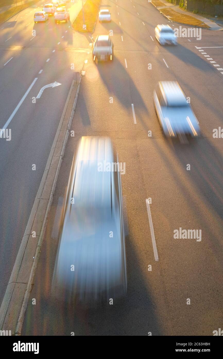 High angle view of cars zooming on a road Stock Photo