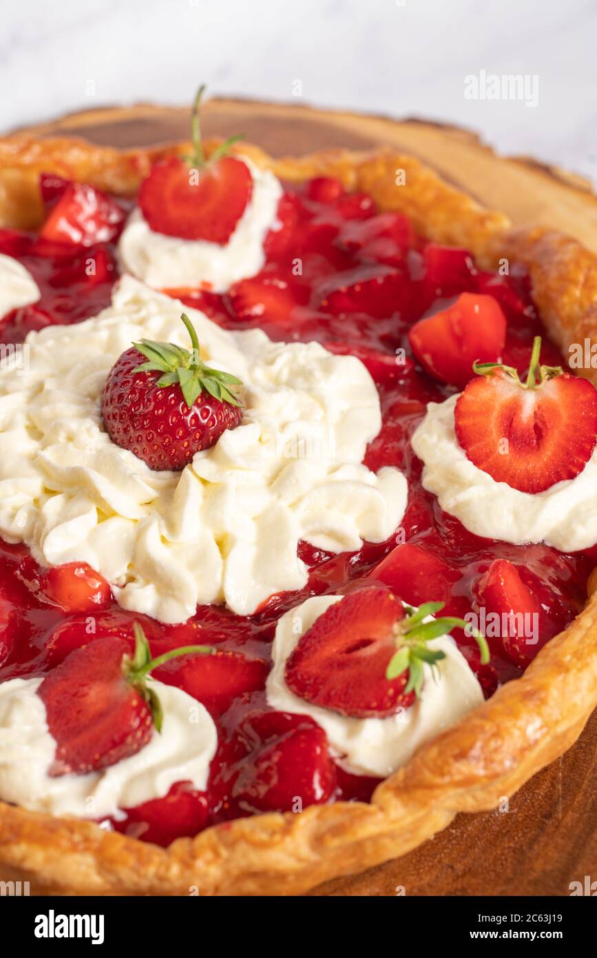 Homemade strawberry pie with whip cream on white background Stock Photo