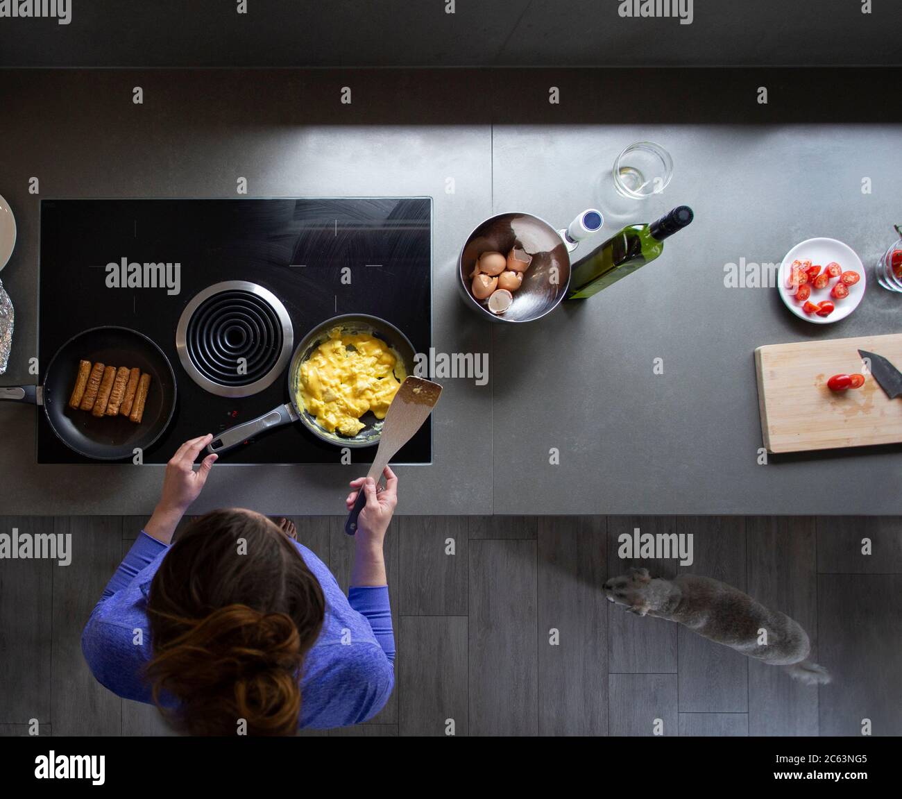 Overhead view of a woman cooking breakfast on the stove Stock Photo Alamy