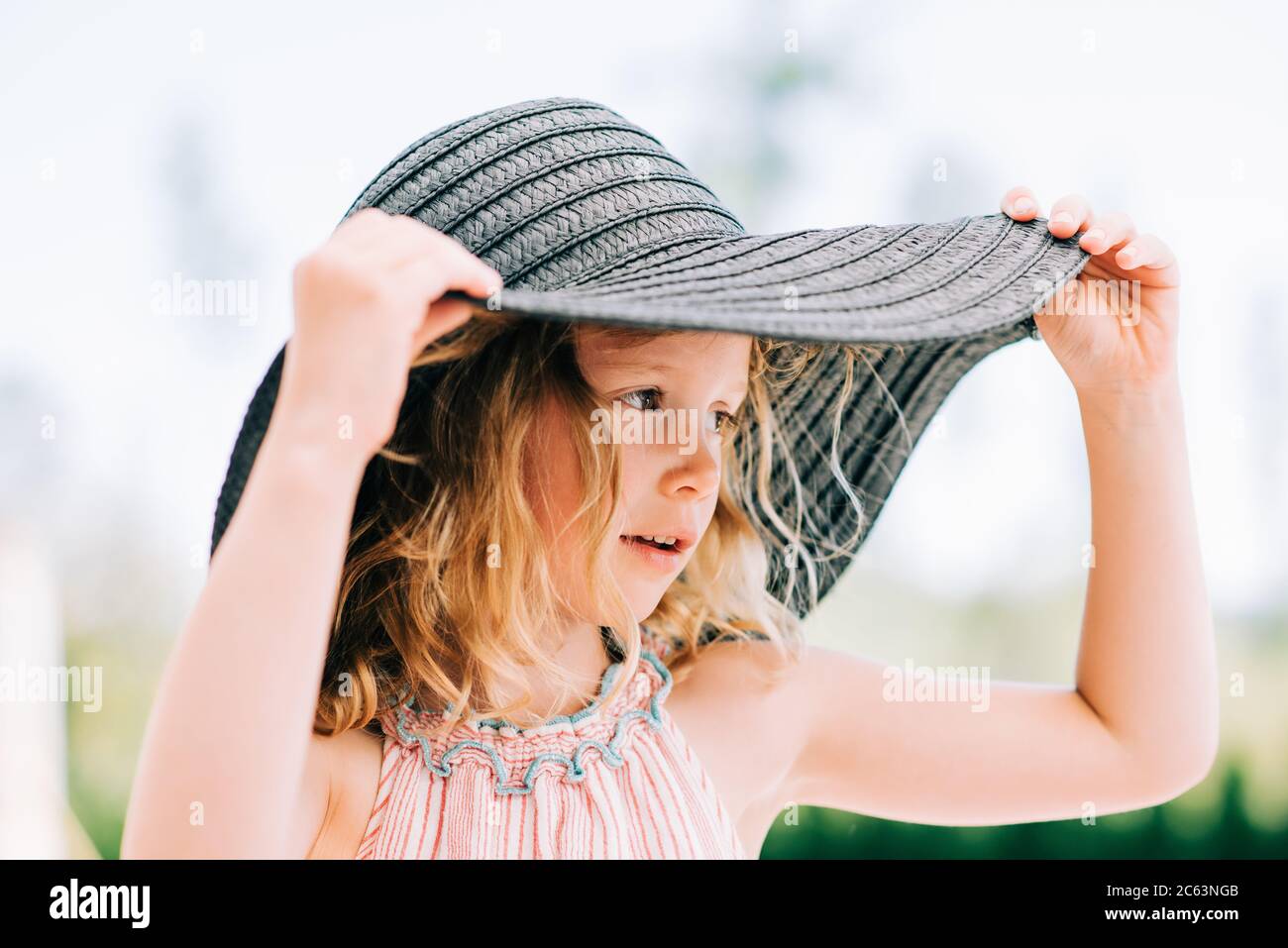 Person wearing a sunhat hi-res stock photography and images - Alamy