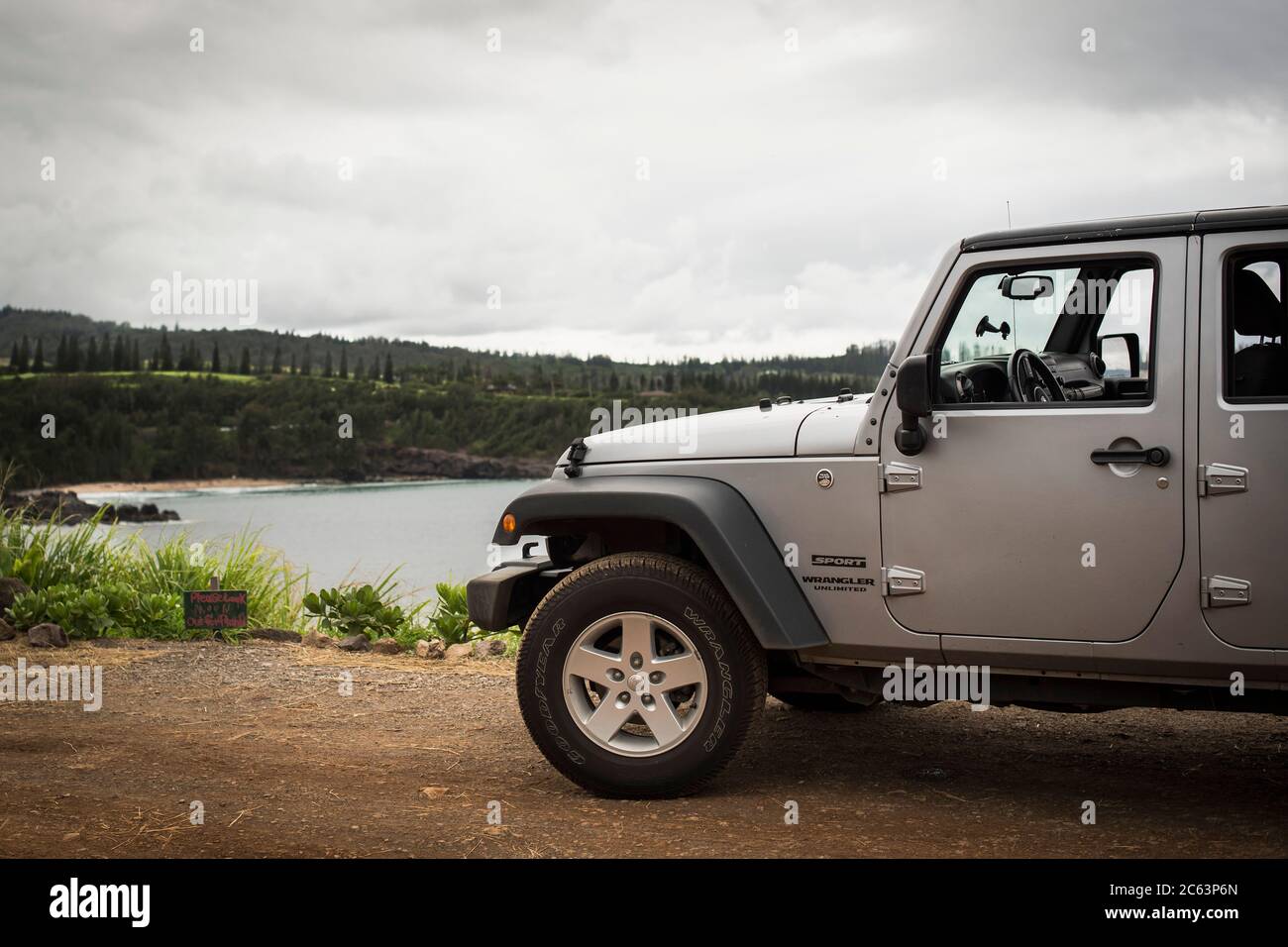 A Jeep Wrangler parked in Honolua Bay placed at the north of Maui Stock Photo