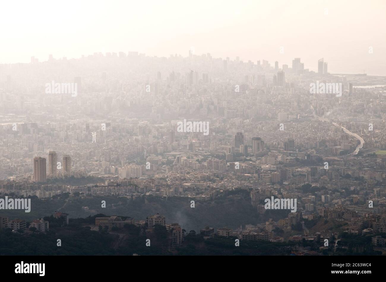 An aerial view of the downtown area of the city of Beirut and coast on a hot day and covered in smog, haze and pollution, Lebanon. Stock Photo