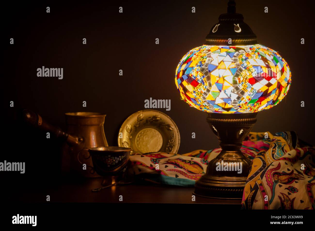 Table lamp of Turkish origin on wooden table and Turkish decoration Stock Photo