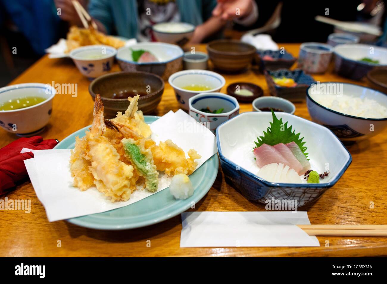 Shrimp tempura, sashimi, and other dishes are a set of Japanese dishes. Stock Photo