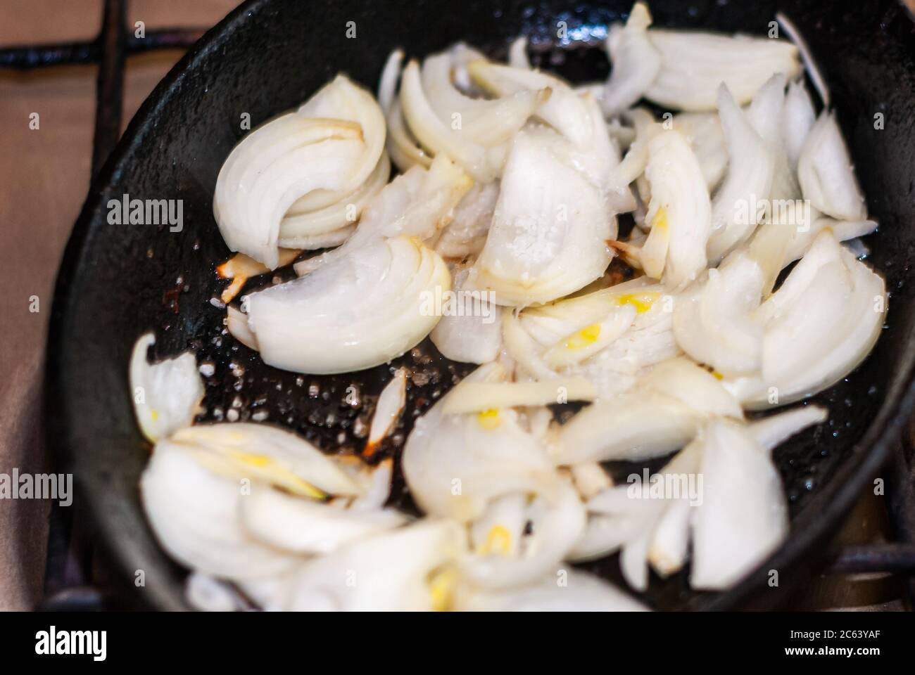 Frying onion. Minced onion in frying pan.selective focus Stock Photo