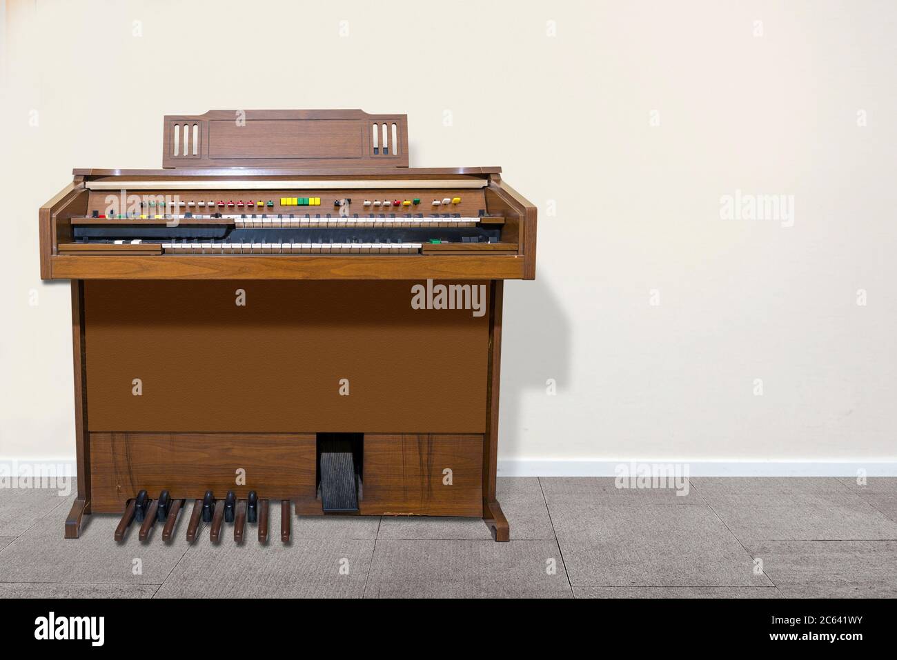 Old double keyboard electric organ with white wall background Stock ...