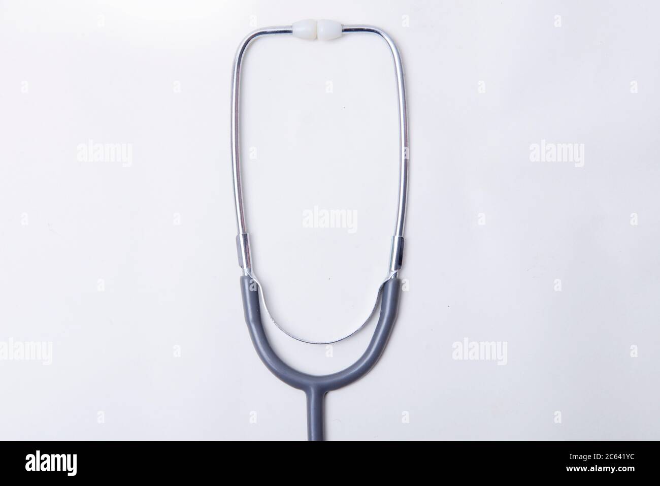Black stethoscope isolated over white background Stock Photo - Alamy