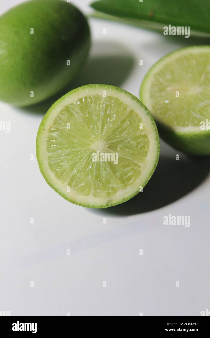 isolated Sliced lemon on white surface Stock Photo