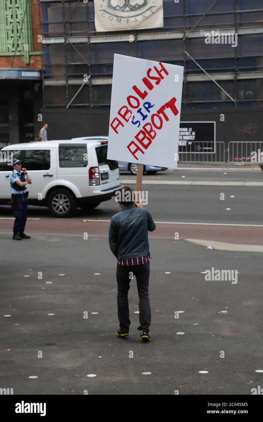 A student protester carries a sig saying, ‘Abolish Sir Abbott’ at the strike action at UTS on Broadway. Stock Photo