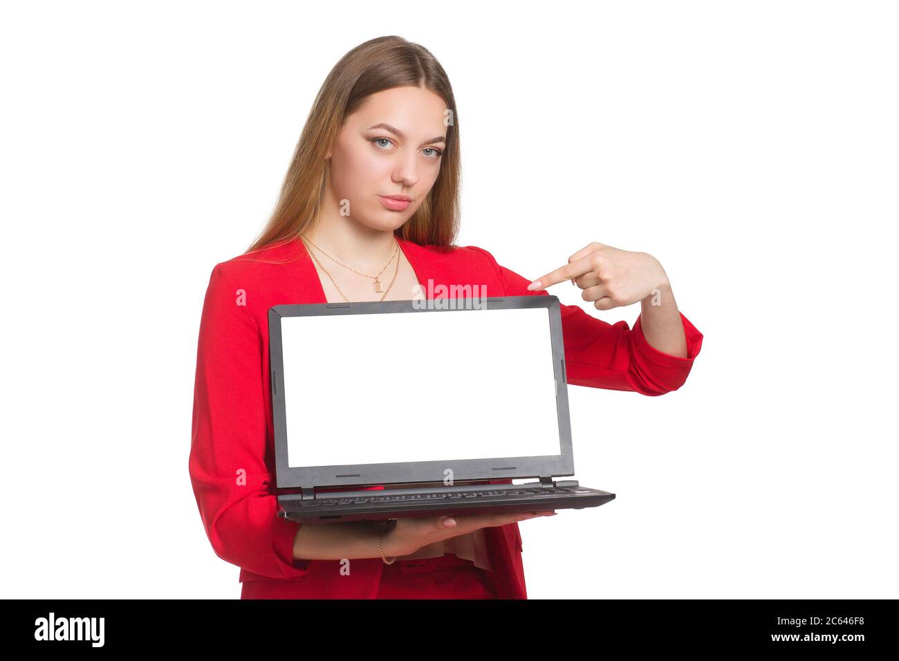 Young woman showing a laptop over white background, and pointing finger to white screen of notebook with copy space for presenting application or website online or products Stock Photo