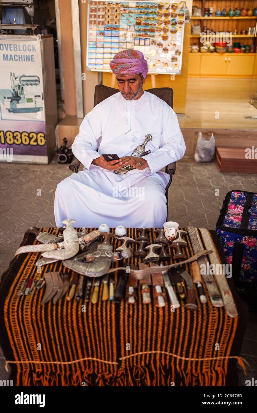 Nizwa / Oman February 15, 2020 Adult Muslim Omani man shop seller