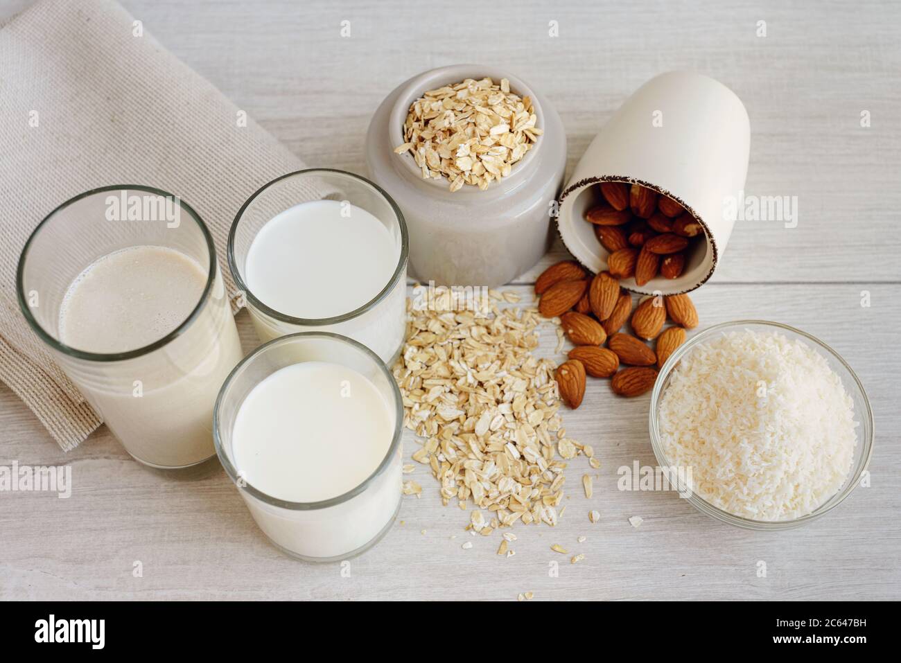 Various vegan plant based milk with ingredients, top view. Milk based