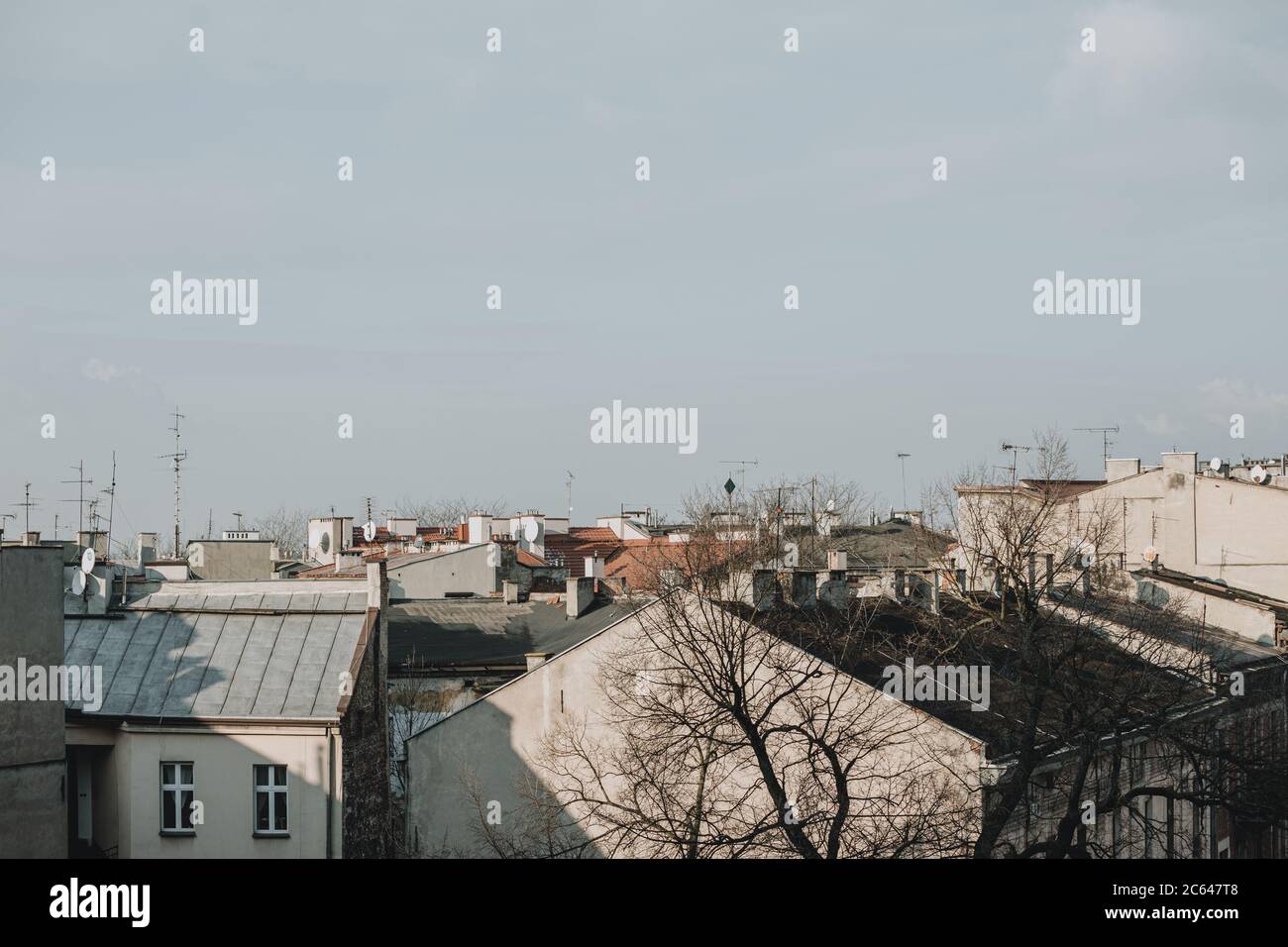 Roofs of the apartment houses in Poland city of Kraków during the sunny