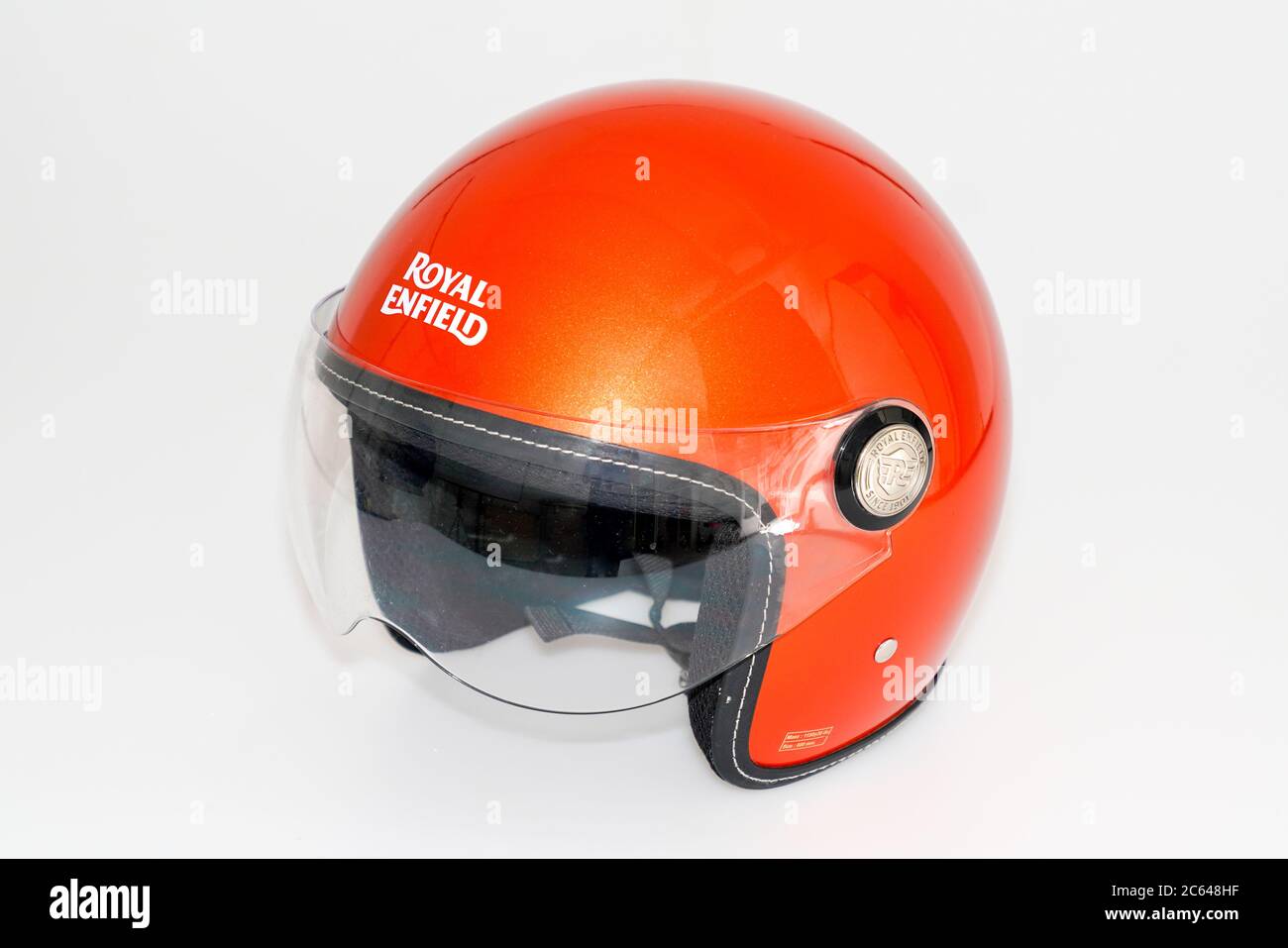 Bordeaux , Aquitaine / France - 07 05 2020 : Royal Enfield logo sign on orange helmet safety worn to protect motorbike man head from injuries Stock Photo