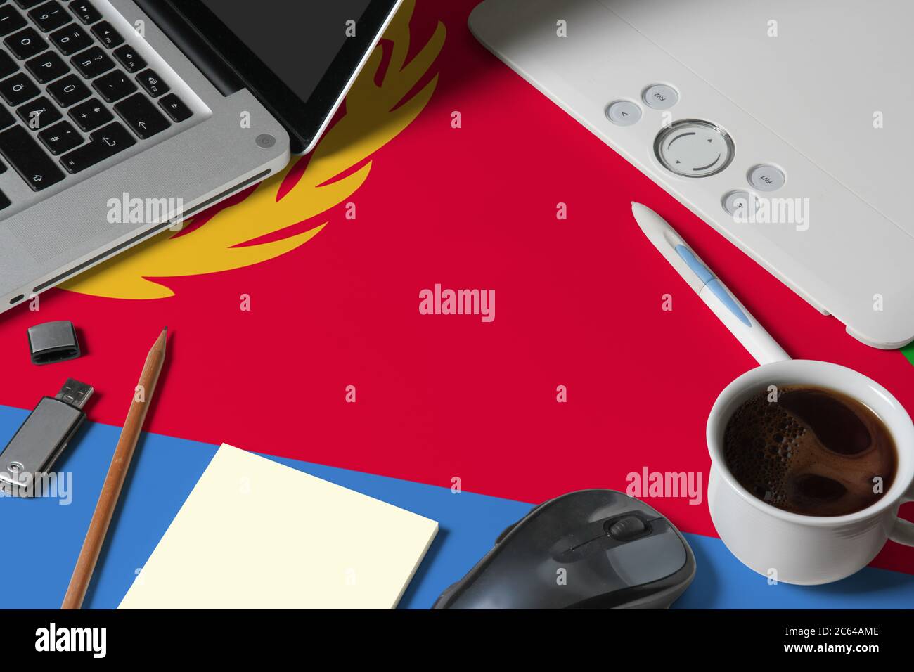 Eritrea national flag on top view work space of creative designer with ...