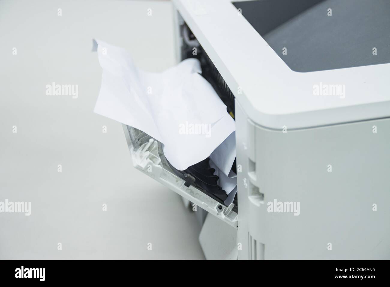 Paper A4 Stuck In Printer At Office, concept repair printer Stock Photo