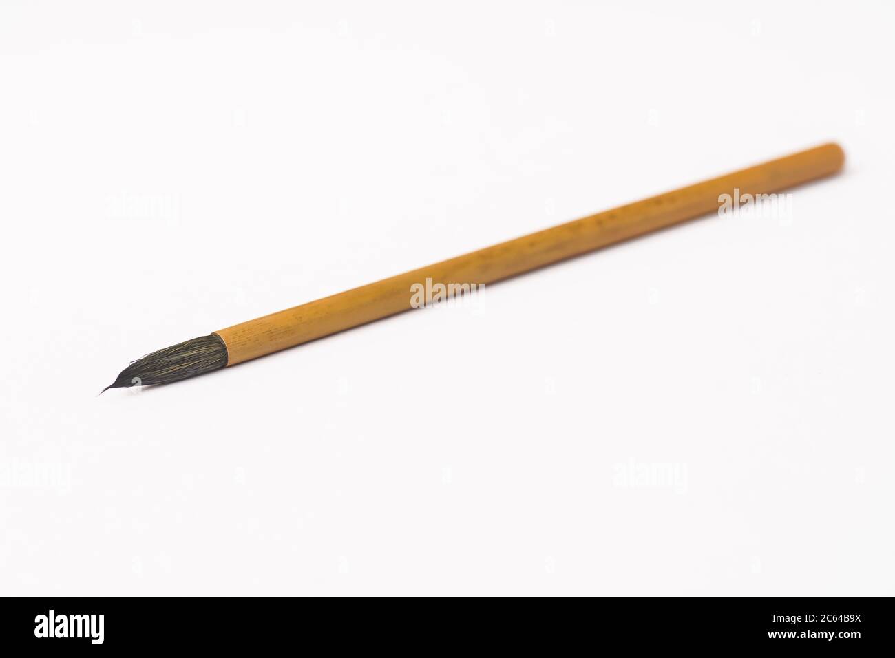 Calligraphy brush isolated against white Stock Photo Alamy