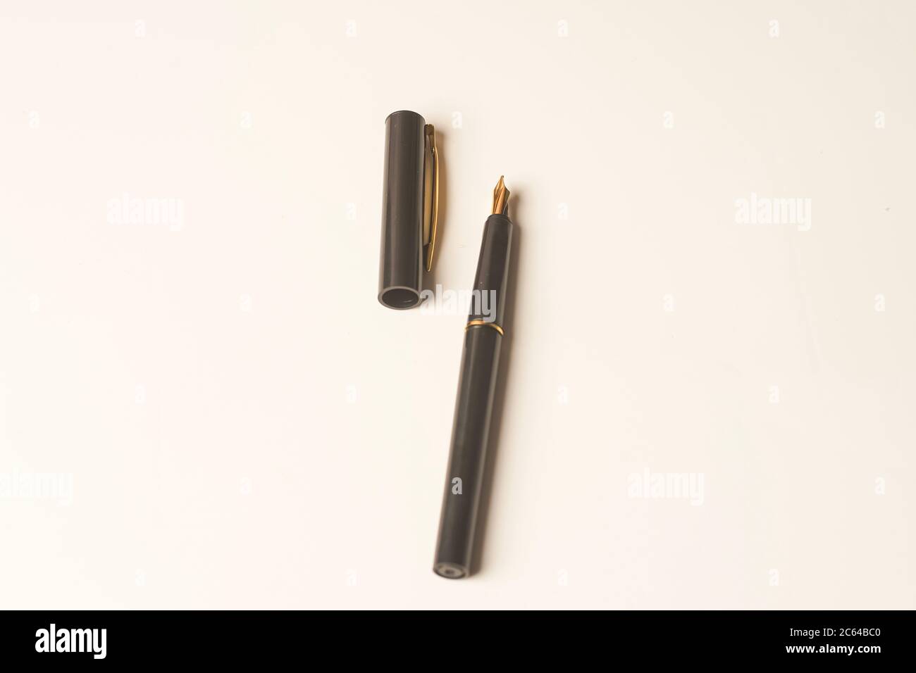 Calligraphy pen isolated on white background Stock Photo - Alamy