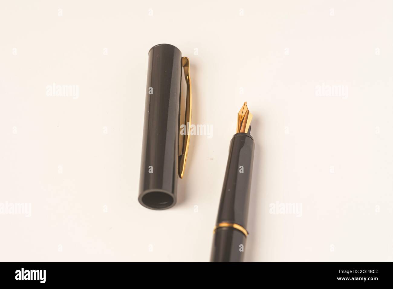 Calligraphy pen isolated on white background Stock Photo - Alamy