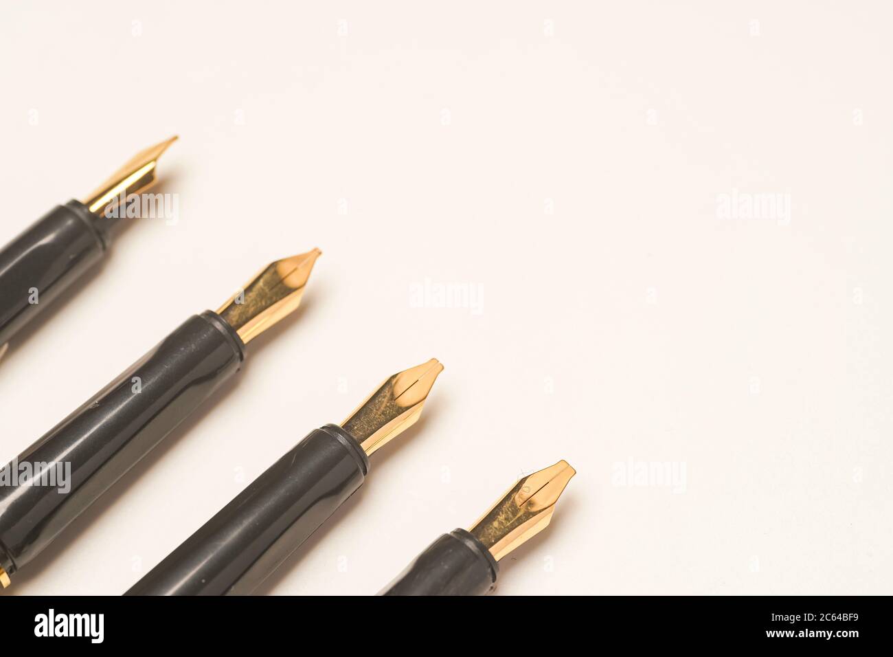 Calligraphy pen isolated on white background Stock Photo - Alamy