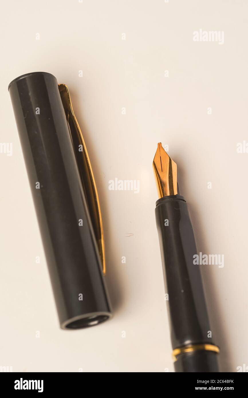 Calligraphy pen isolated on white background Stock Photo - Alamy