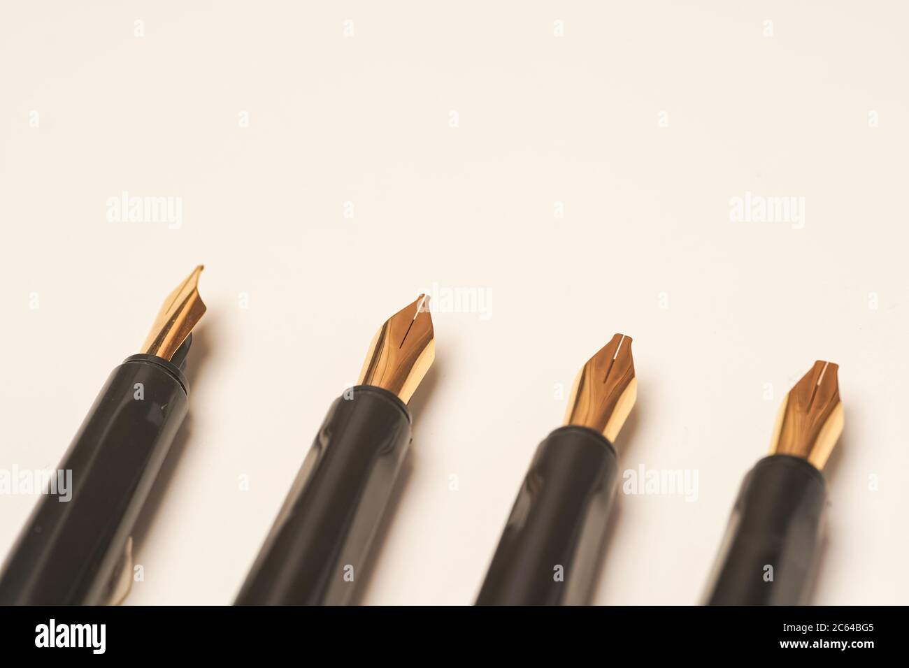 Calligraphy pen isolated on white background Stock Photo - Alamy