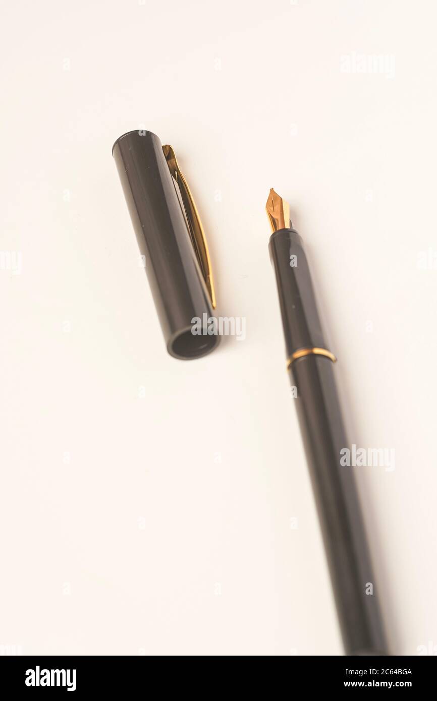Calligraphy pen isolated on white background Stock Photo - Alamy