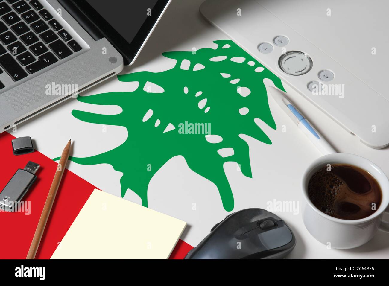Lebanon national flag on top view work space of creative designer with