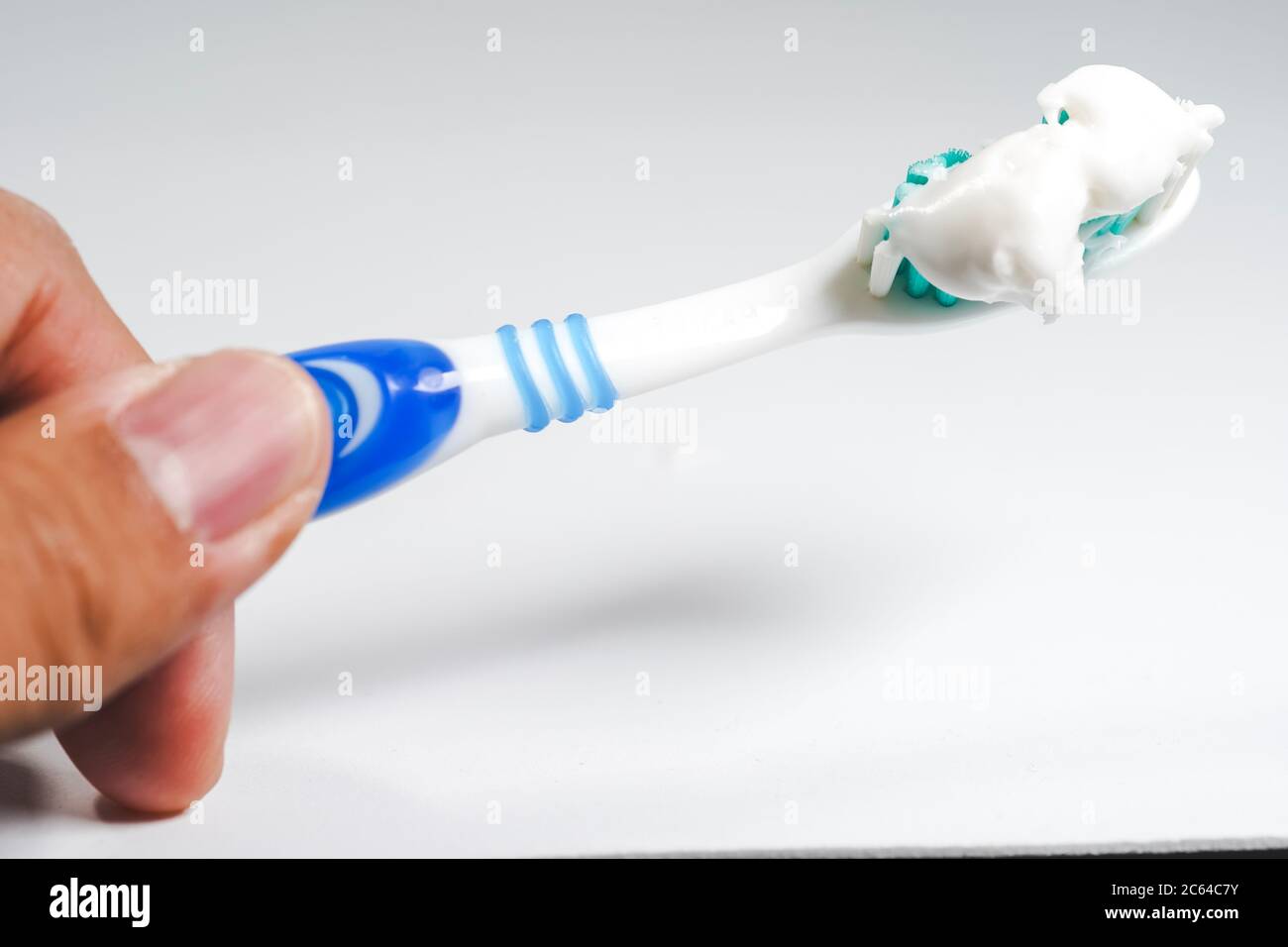 Toothbrush with toothpaste isolated on white background Stock Photo - Alamy
