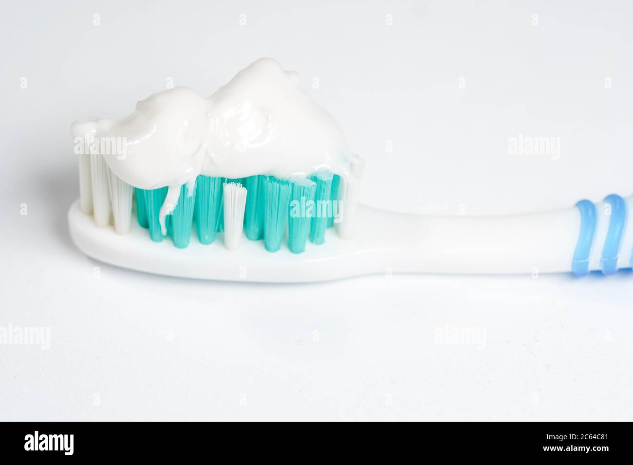 Toothbrush with toothpaste isolated on white background Stock Photo - Alamy
