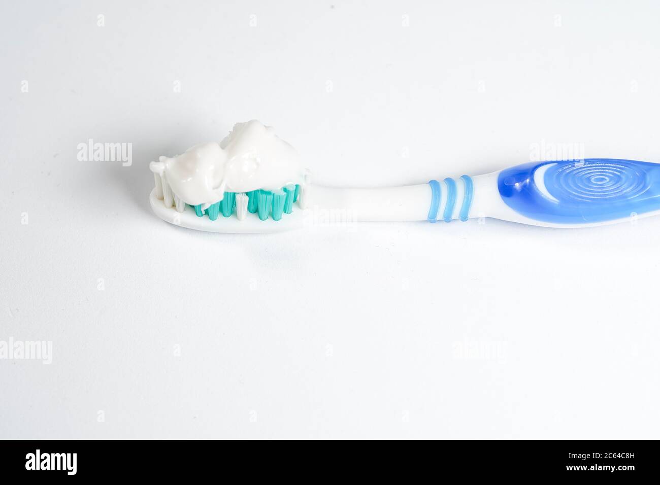 Toothbrush with toothpaste isolated on white background Stock Photo - Alamy