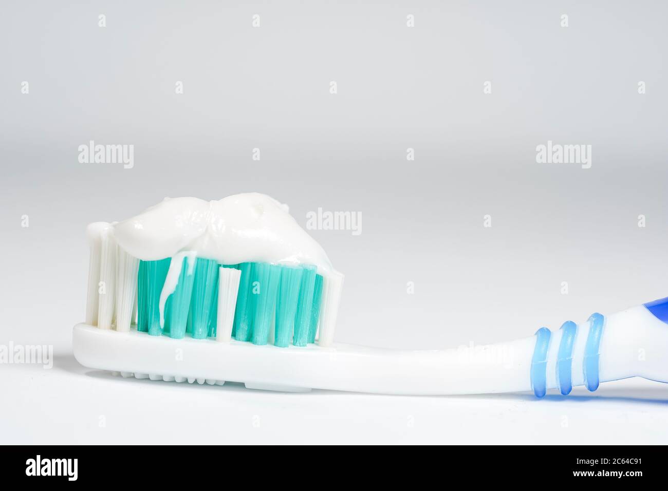 Toothbrush with toothpaste isolated on white background Stock Photo
