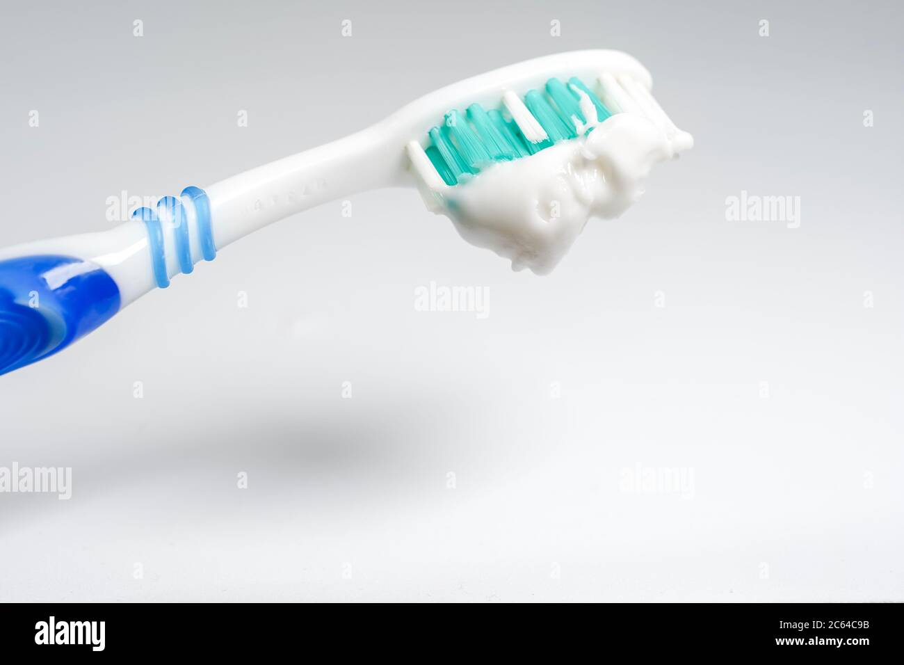 Toothbrush with toothpaste isolated on white background Stock Photo - Alamy