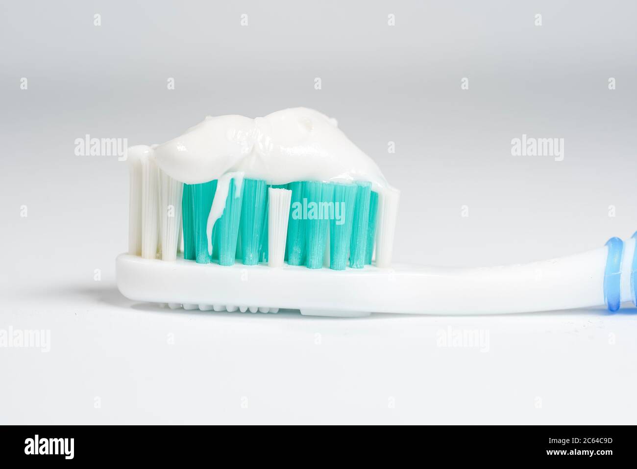 Toothbrush with toothpaste isolated on white background Stock Photo - Alamy