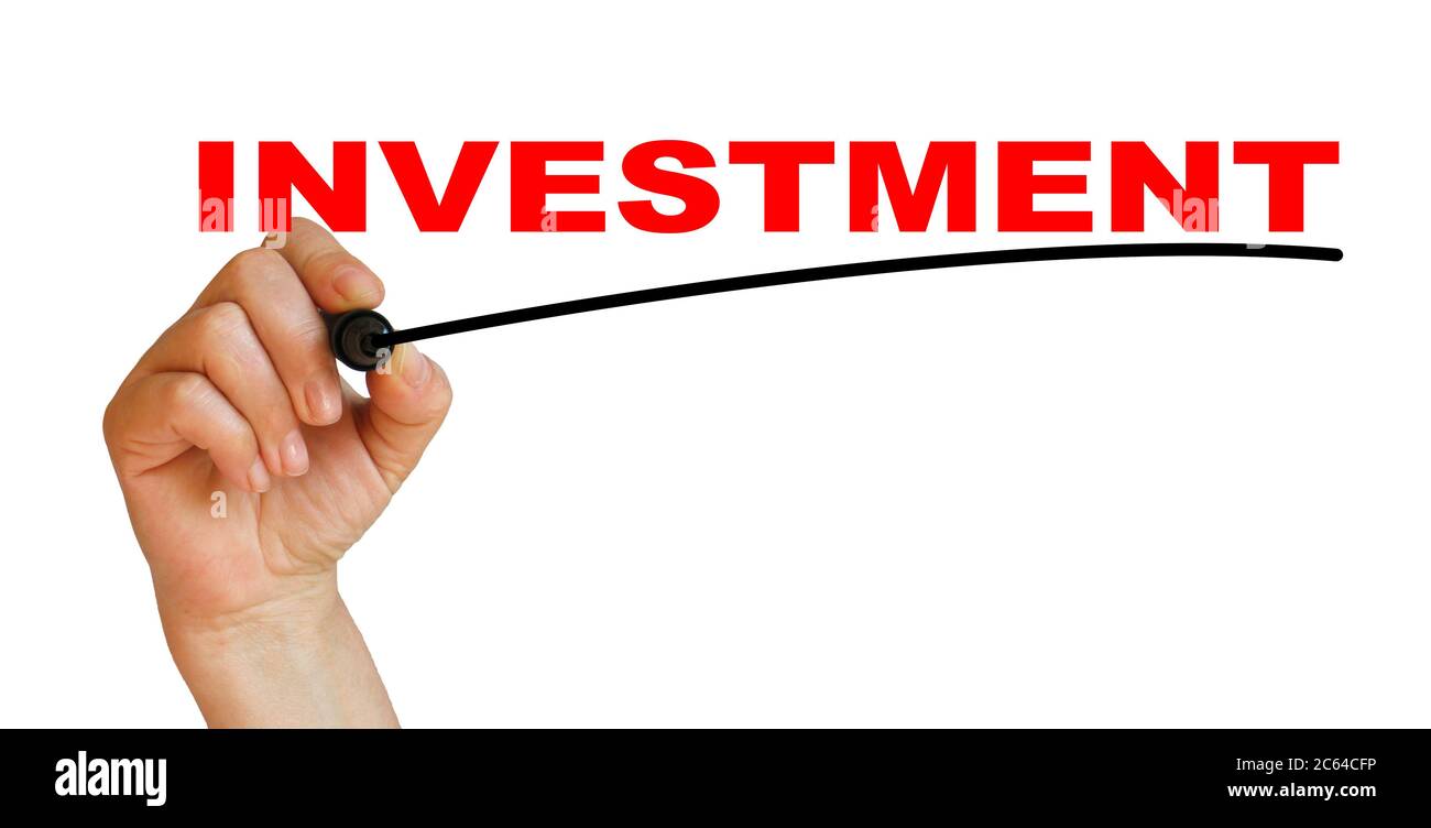 Hand underlining investment with red marker Stock Photo