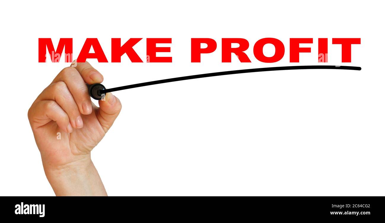 Hand underlining make profit with red marker Stock Photo