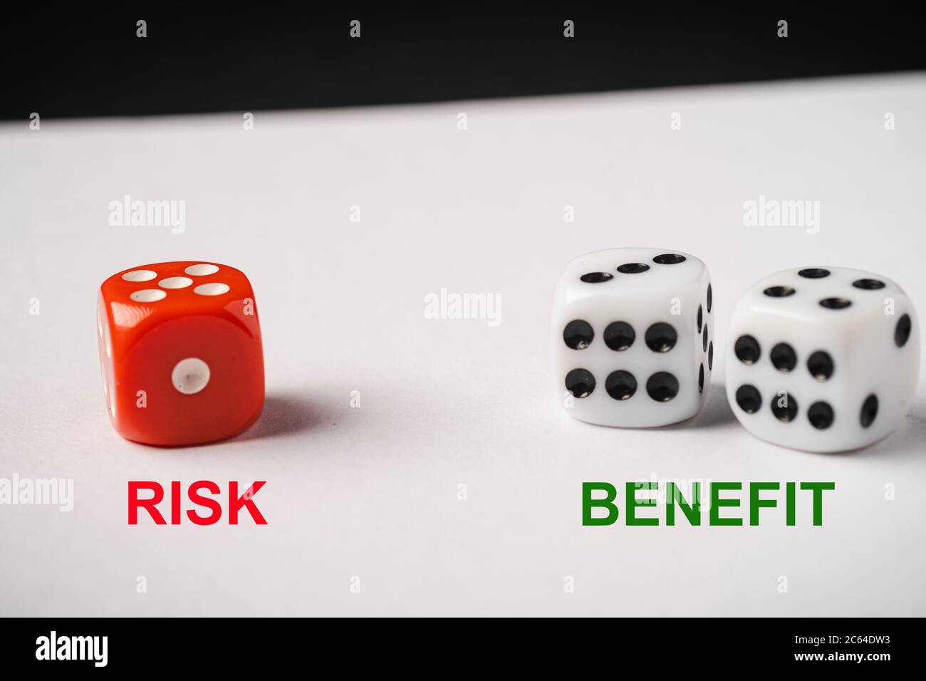 Red and White dices, Risk vs Reward conceptual shot Stock Photo Alamy