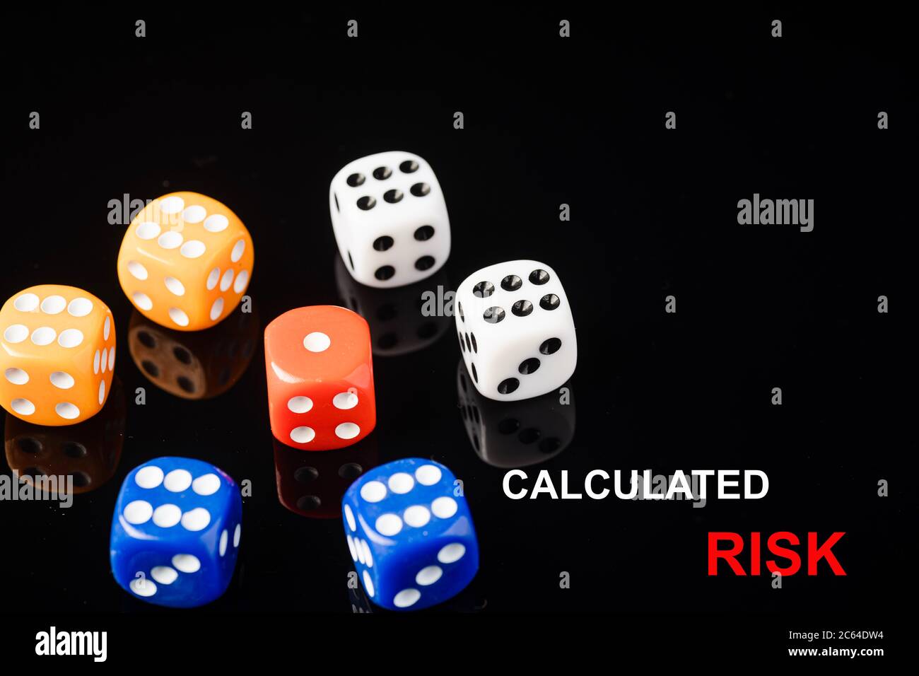 “CALCULATED RISK” wordings with red dices surrounded by blue, orange ...