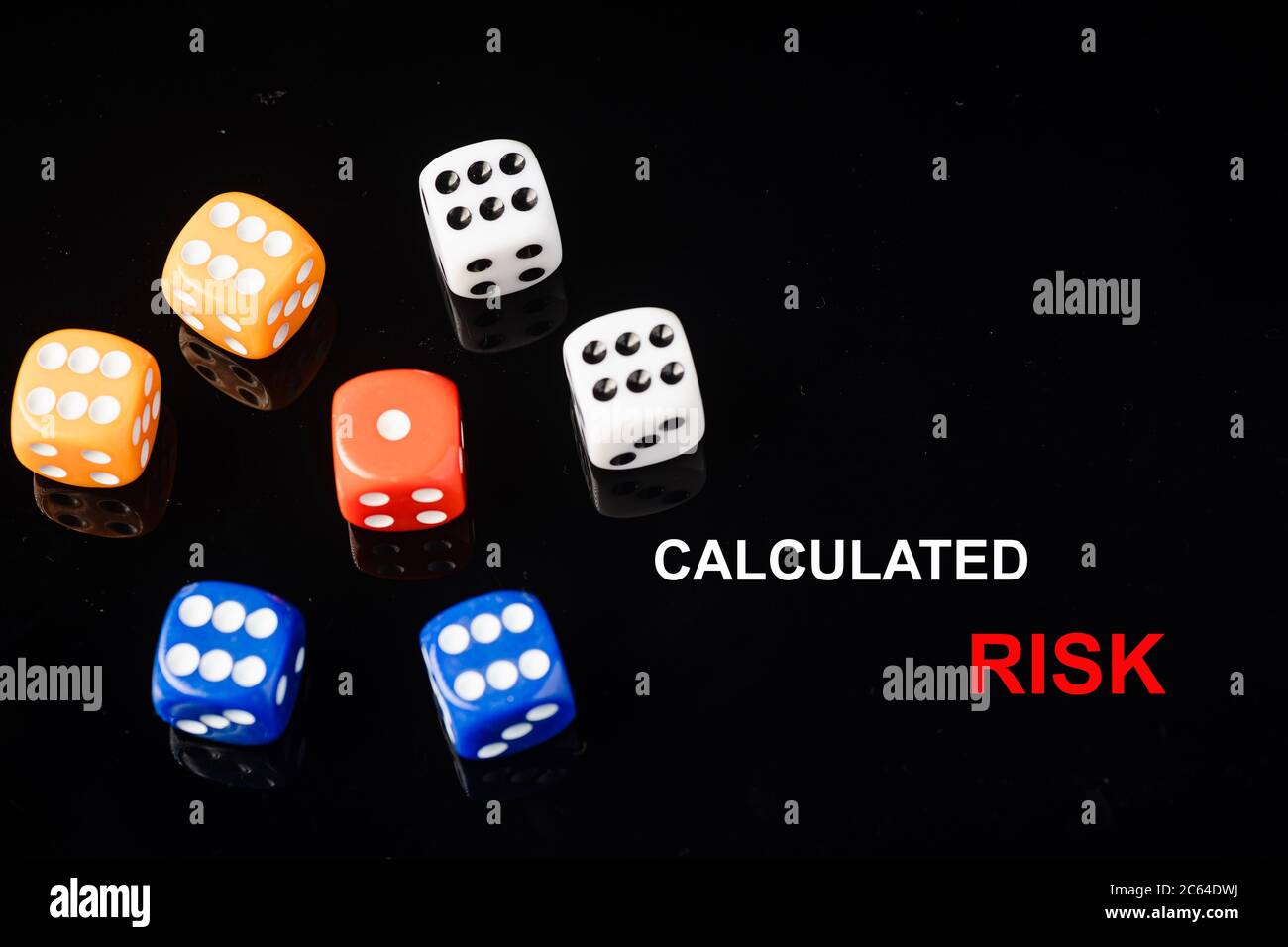 “CALCULATED RISK” wordings with red dices surrounded by blue, orange ...