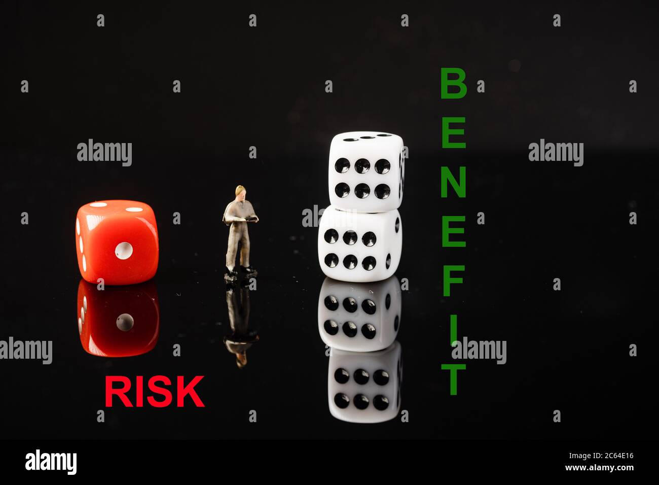 “RISK VS REWARD” wordings with red and white dices, conceptual shot ...