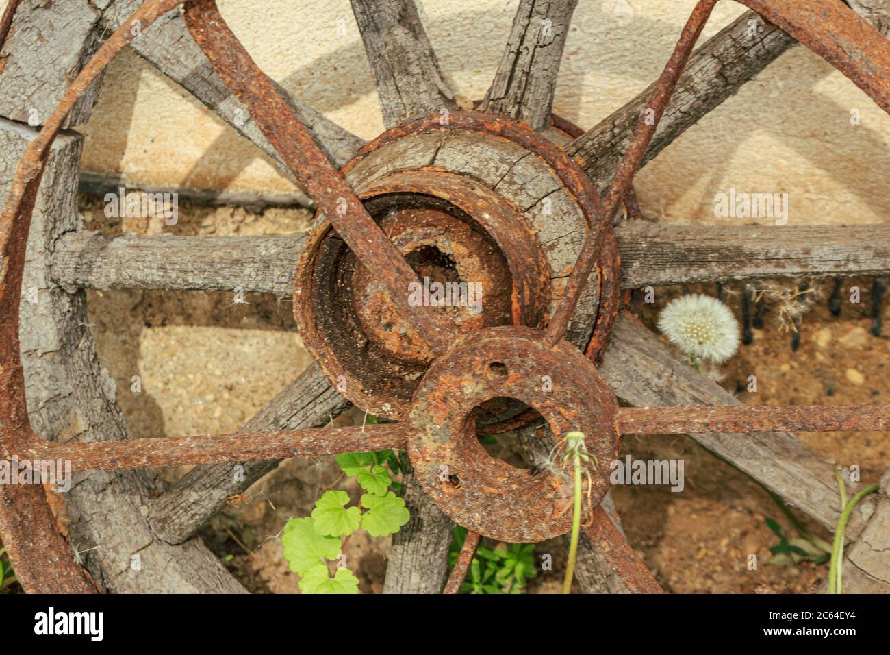Old Rusted Wheel Old rusted wood and metal cart wheel Stock Photo - Alamy