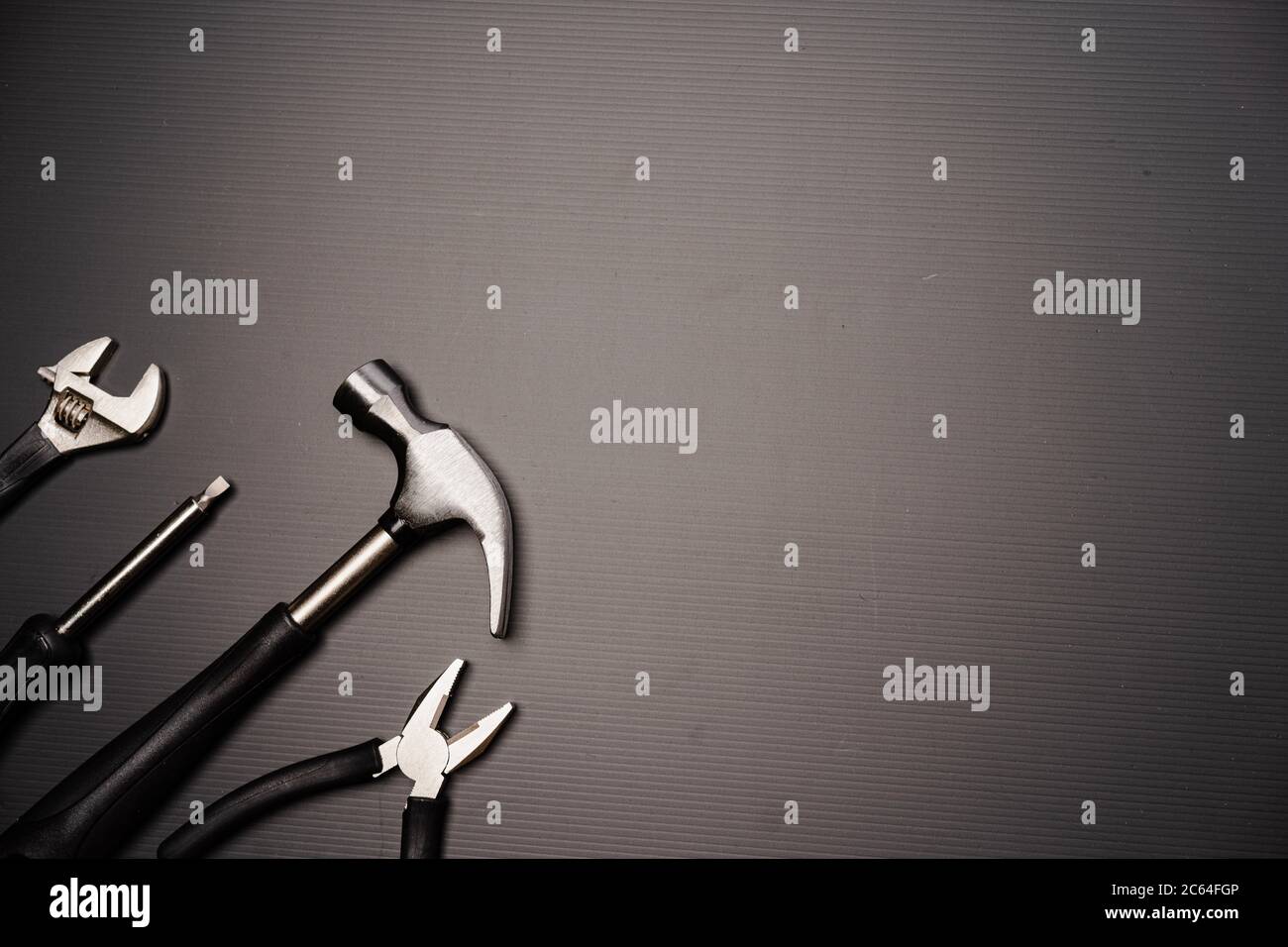 Flat lay composition of a set of tools, including hammer, pliers ...