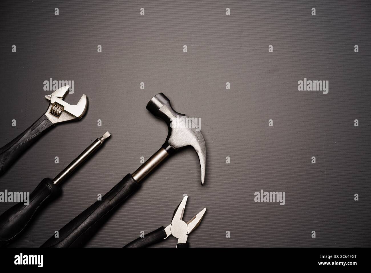 Flat lay composition of a set of tools, including hammer, pliers ...