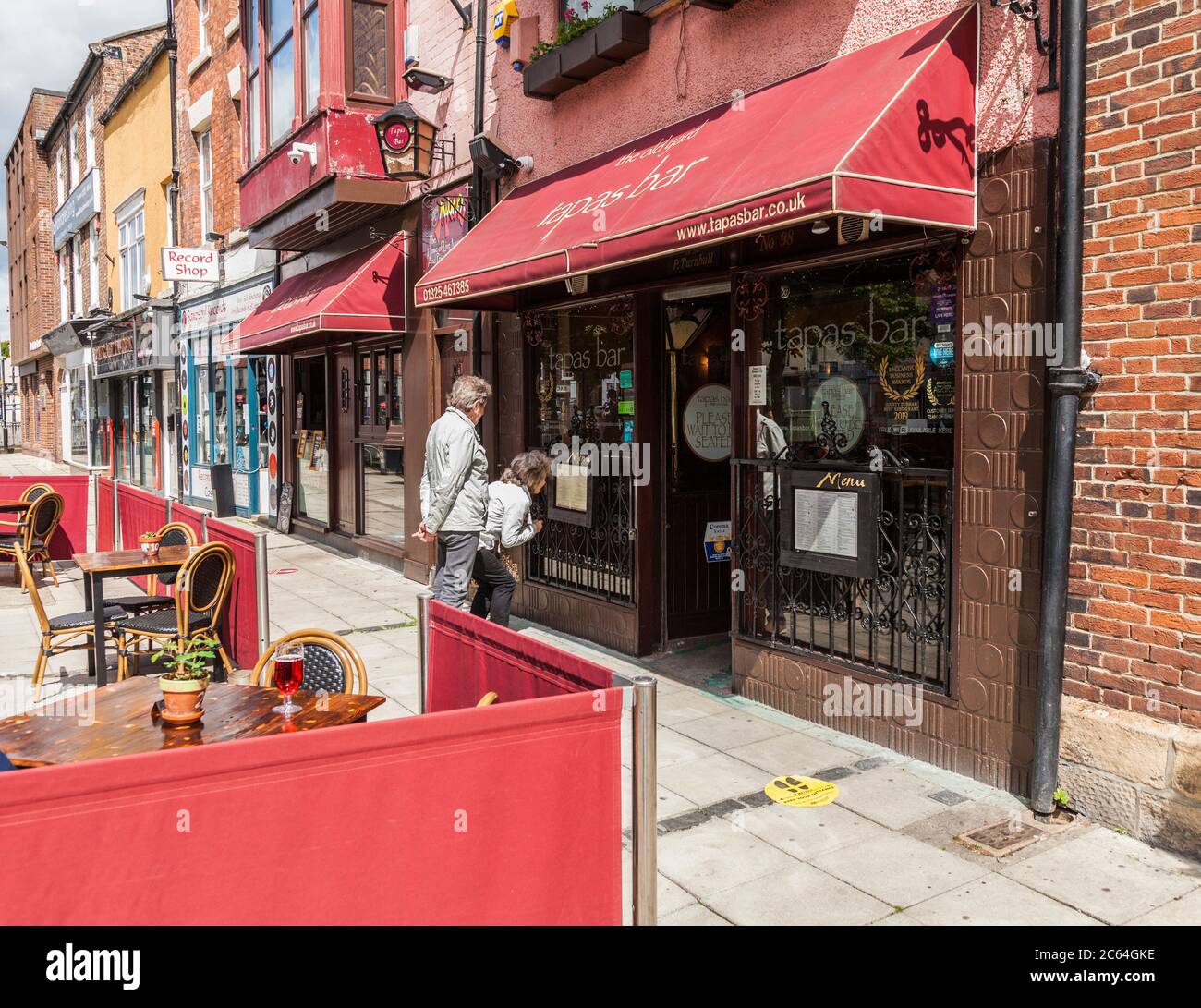 A couple look at the menu in the window of the Tapas Bar in Darlington