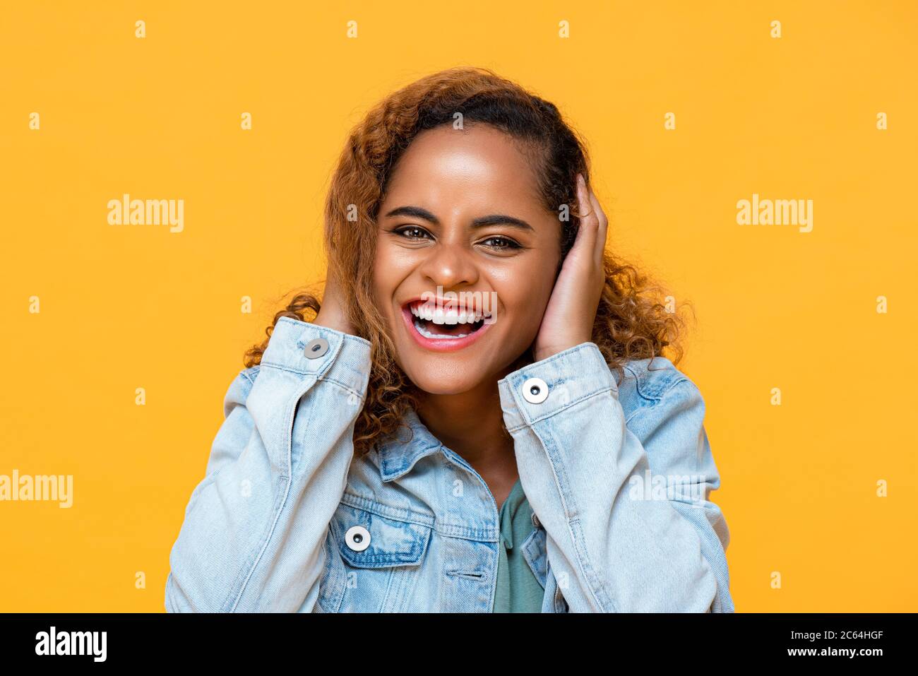 Fun close up portrait of happy young African American woman laughing ...