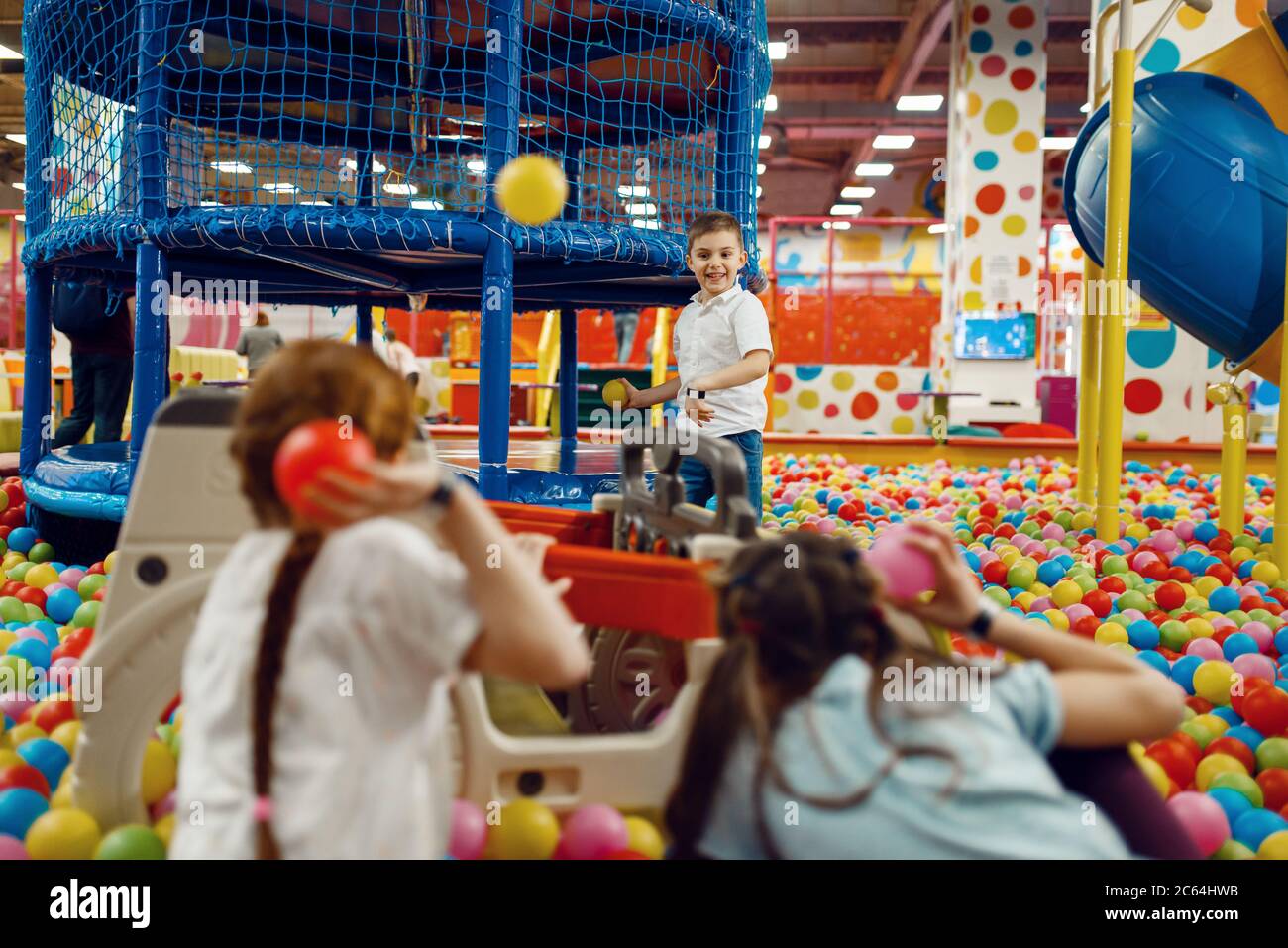 Children throw balls in the entertainment center Stock Photo Alamy