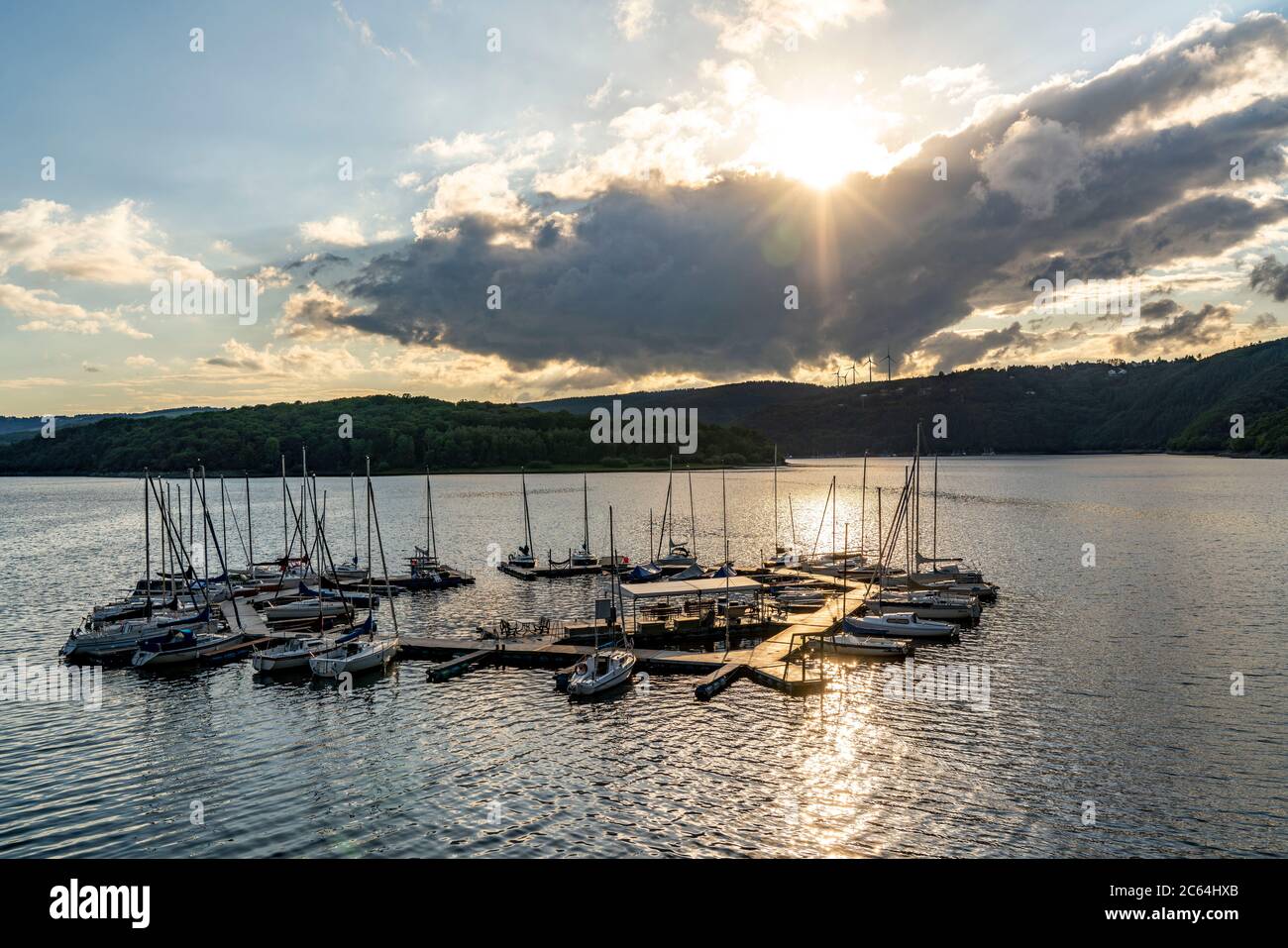 The Rursee, reservoir in the Eifel National Park, north-east shore near Heimbach, near the Rur dam Schwammenauel, sailing boats at the floating jetty, Stock Photo