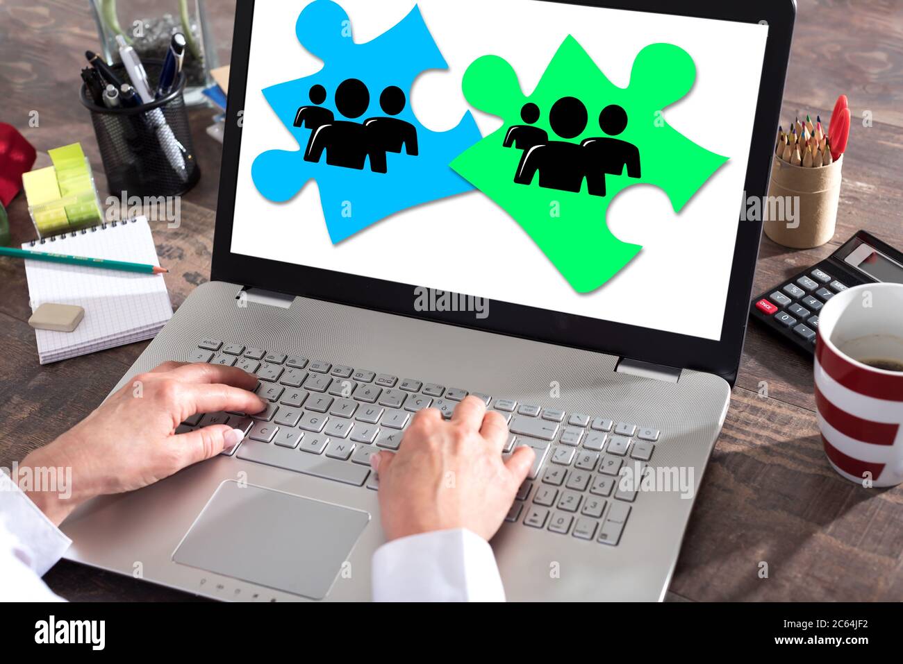 Teamwork concept shown on a laptop screen Stock Photo - Alamy