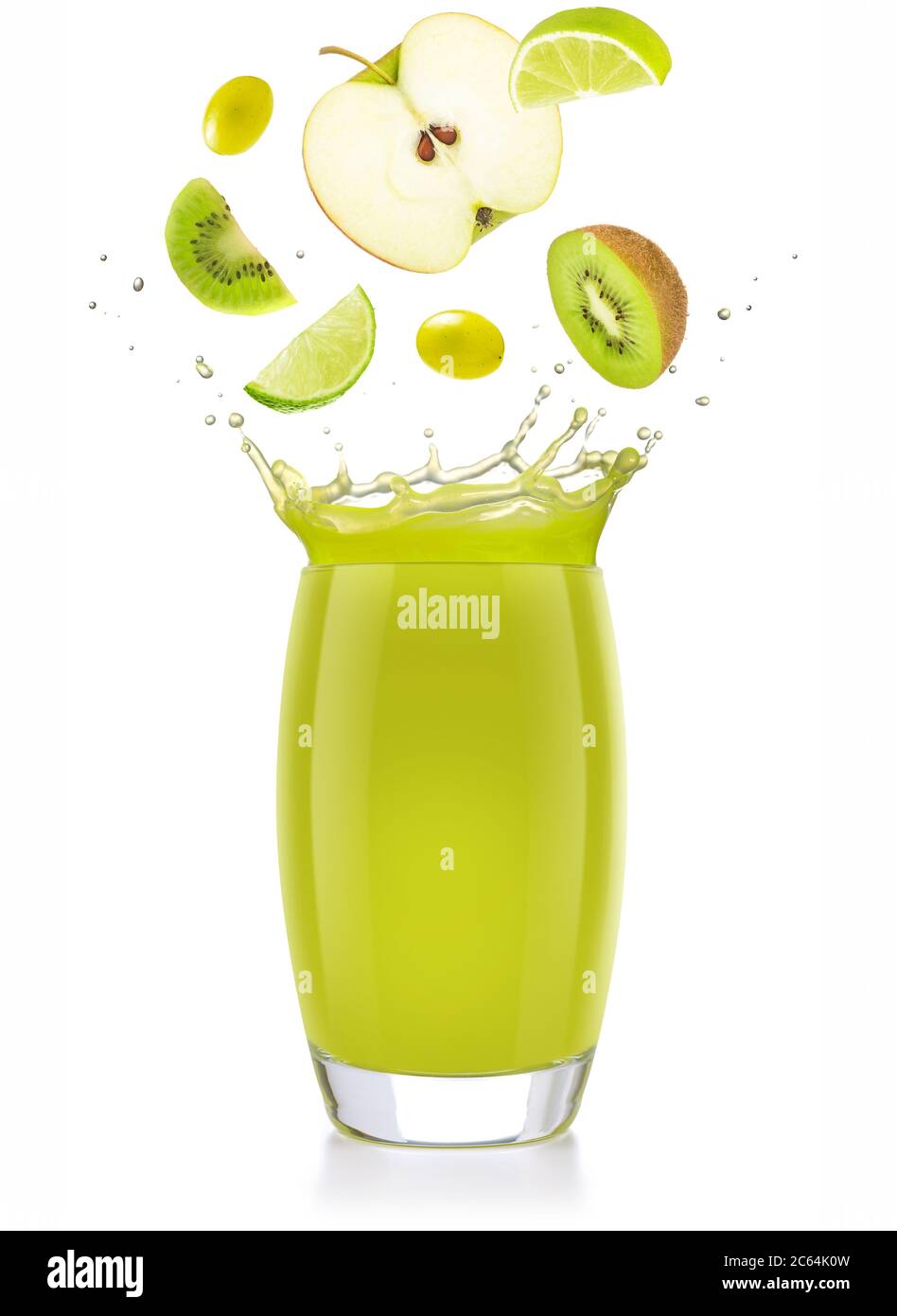 mixed green fruit falling into a splashing juice glass isolated on white Stock Photo